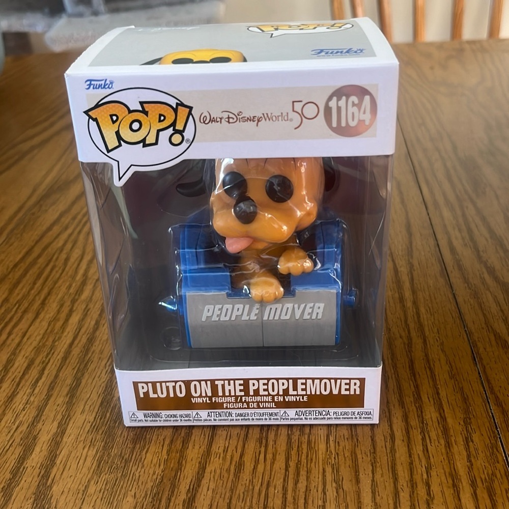 Pluto on the Peoplemover Funko pop #1164.